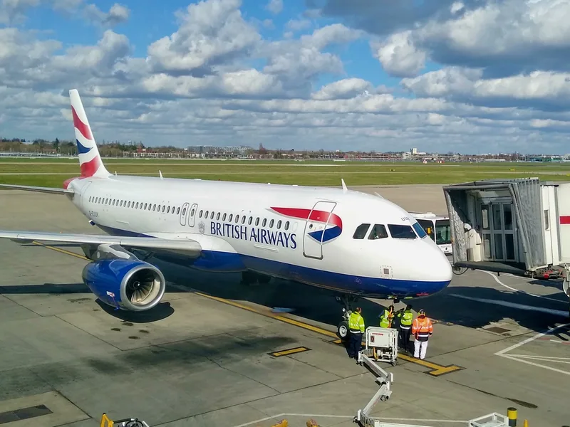 A British Airways Airbus A320 on stand at an air bridge at Heathrow Terminal 5