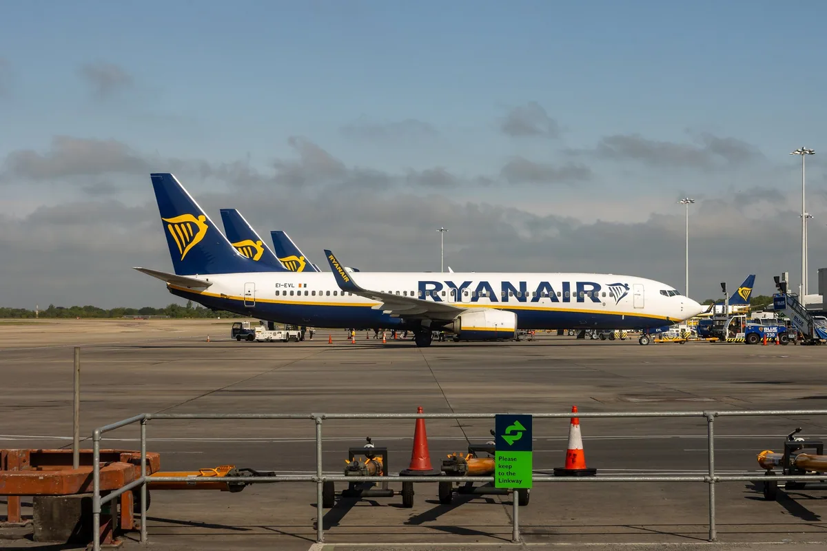 Ryanair Boeing 737s parked on the apron at London Stansted Airport under an evening sky