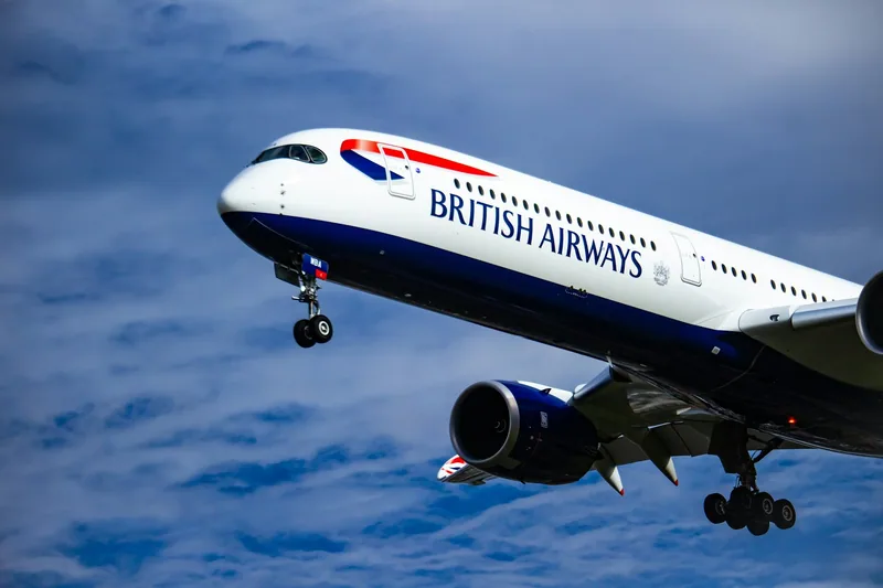 British Airways Airbus A350 on final approach to Heathrow against a blue sky