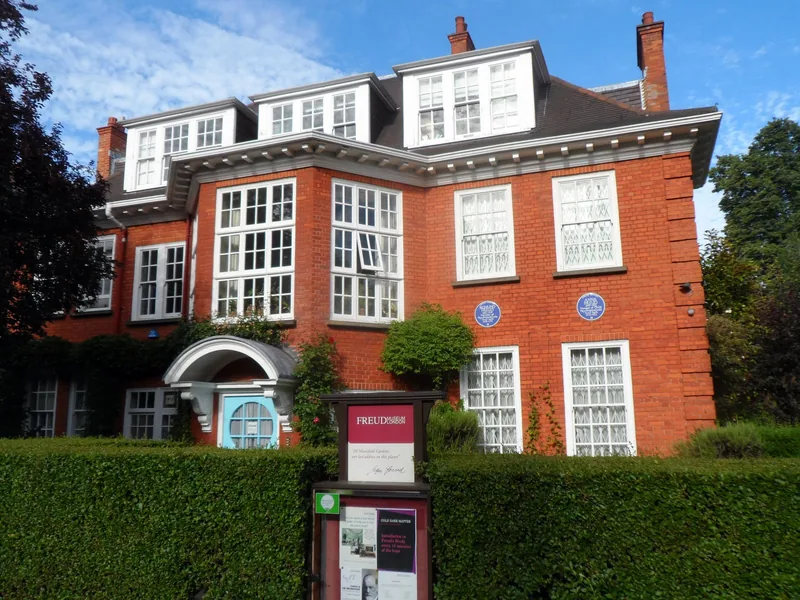 The red brick house at 20 Maresfield Gardens in Hampstead that holds the Freud Museum, with blue plaques on the wall