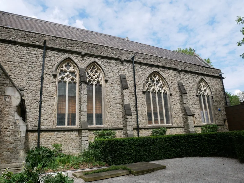 The stone south wall and Gothic windows of the former church of St Mary at Lambeth, which houses the Garden Museum
