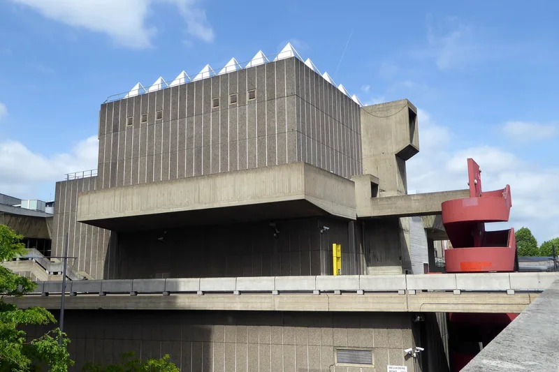 The Hayward Gallery's stacked concrete volumes and red sculpture seen from Waterloo Bridge