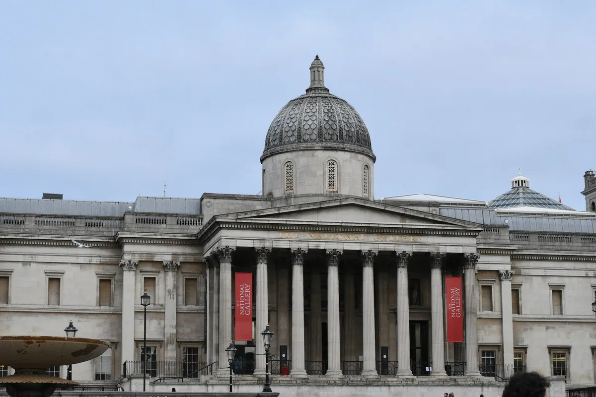 The National Gallery's domed portico and red banners facing Trafalgar Square