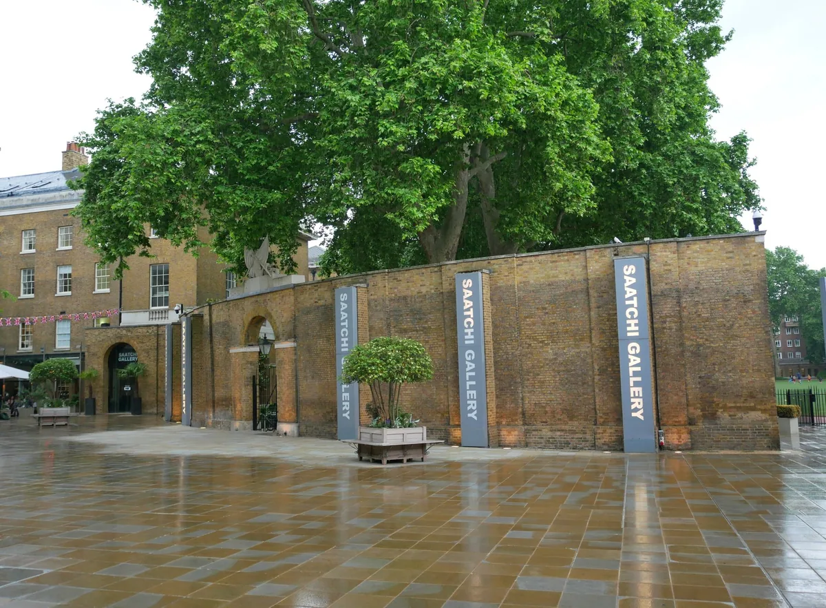 Saatchi Gallery banners along the brick wall of the Duke of York's Headquarters in Chelsea