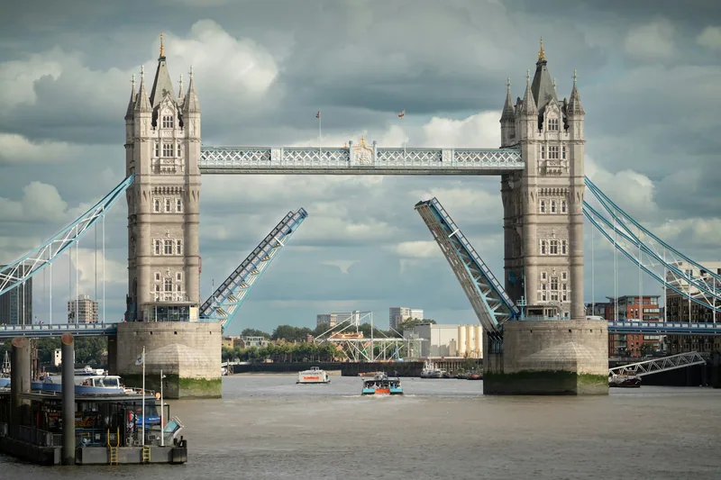 Tower Bridge with both bascules raised to let river traffic pass along the Thames