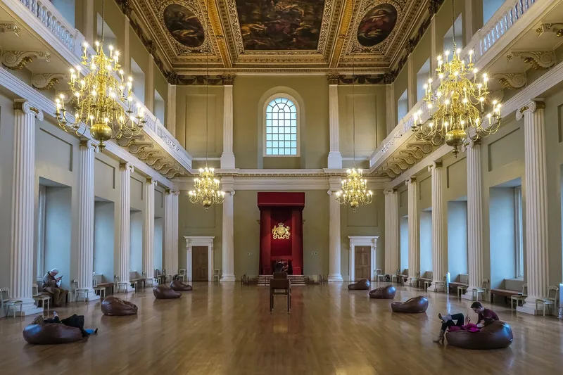 The double-cube main hall of the Banqueting House with chandeliers, the throne canopy and the Rubens ceiling above