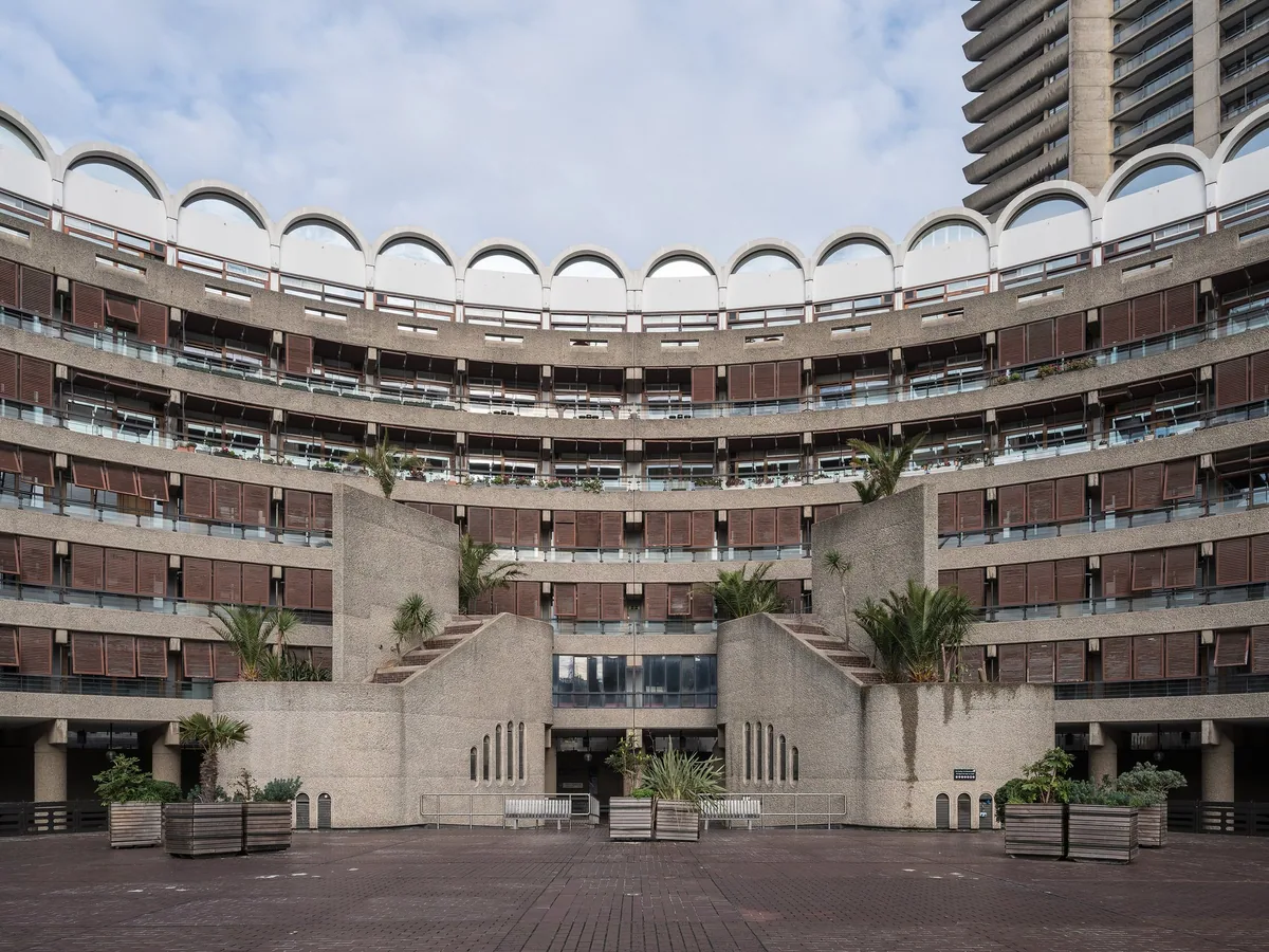 The curved concrete tiers and arched top floor of Frobisher Crescent at the Barbican Estate