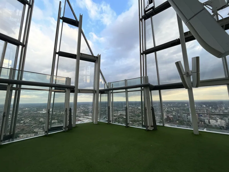 The open-air viewing level near the top of the Shard, its angled glass panes framing a wide view over London