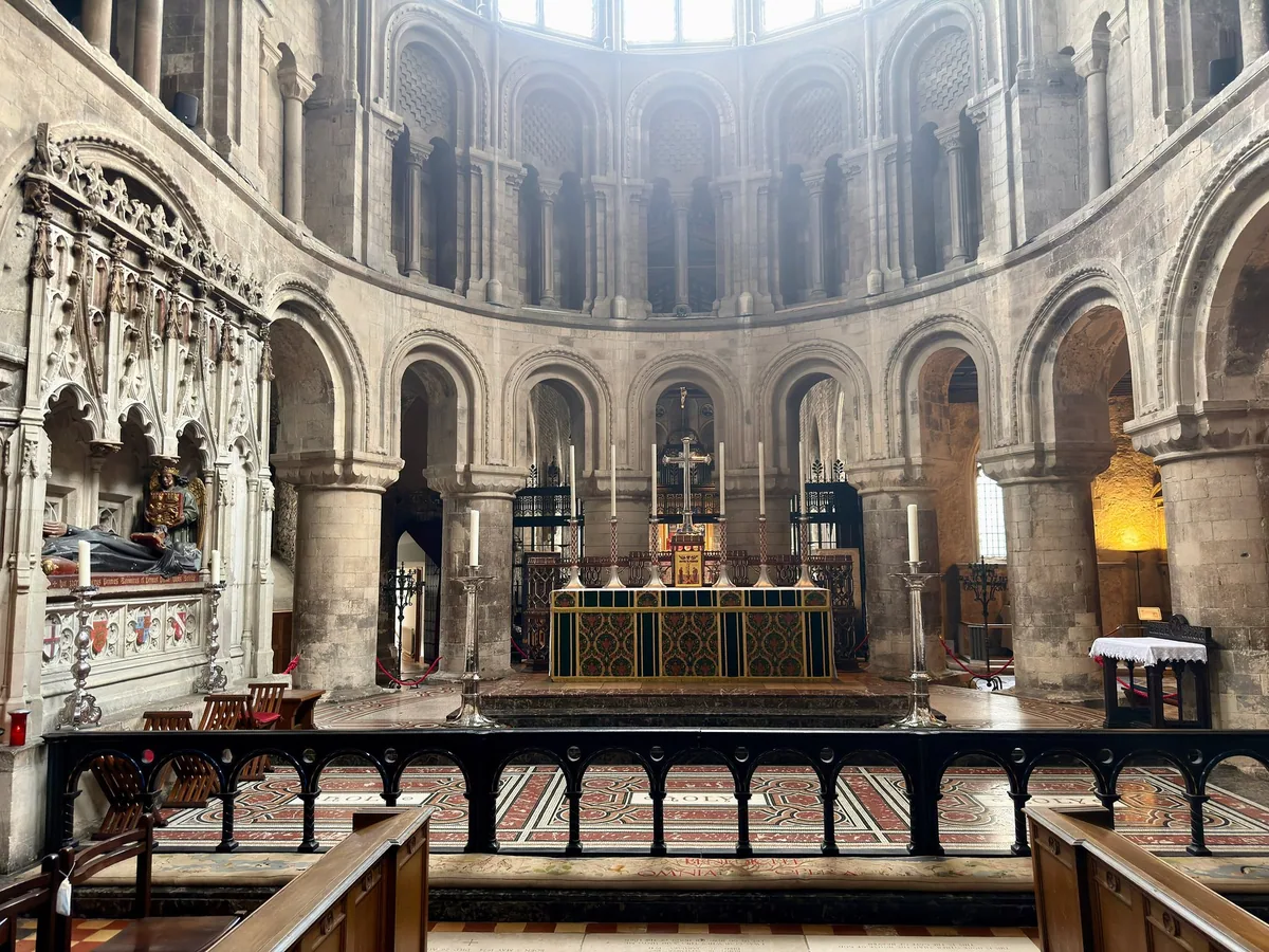The Norman apse and high altar of St Bartholomew the Great, with tiers of round stone arches above
