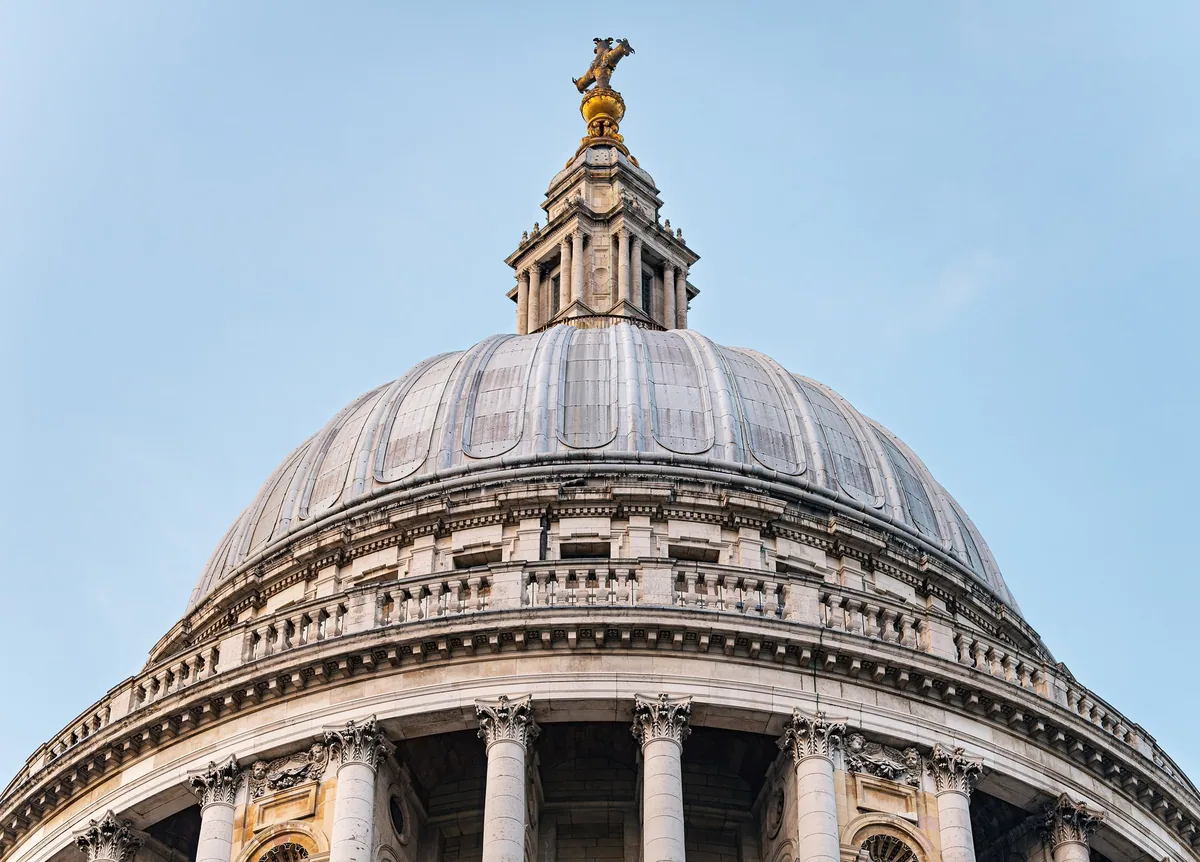 The lead-covered dome of St Paul's Cathedral and its golden lantern, seen from ground level