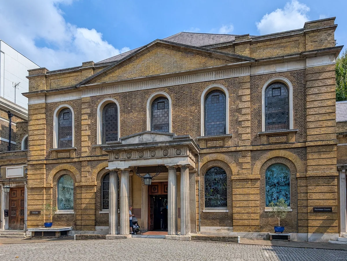 The yellow-brick front of Wesley's Chapel on City Road, with its columned porch and round-arched windows