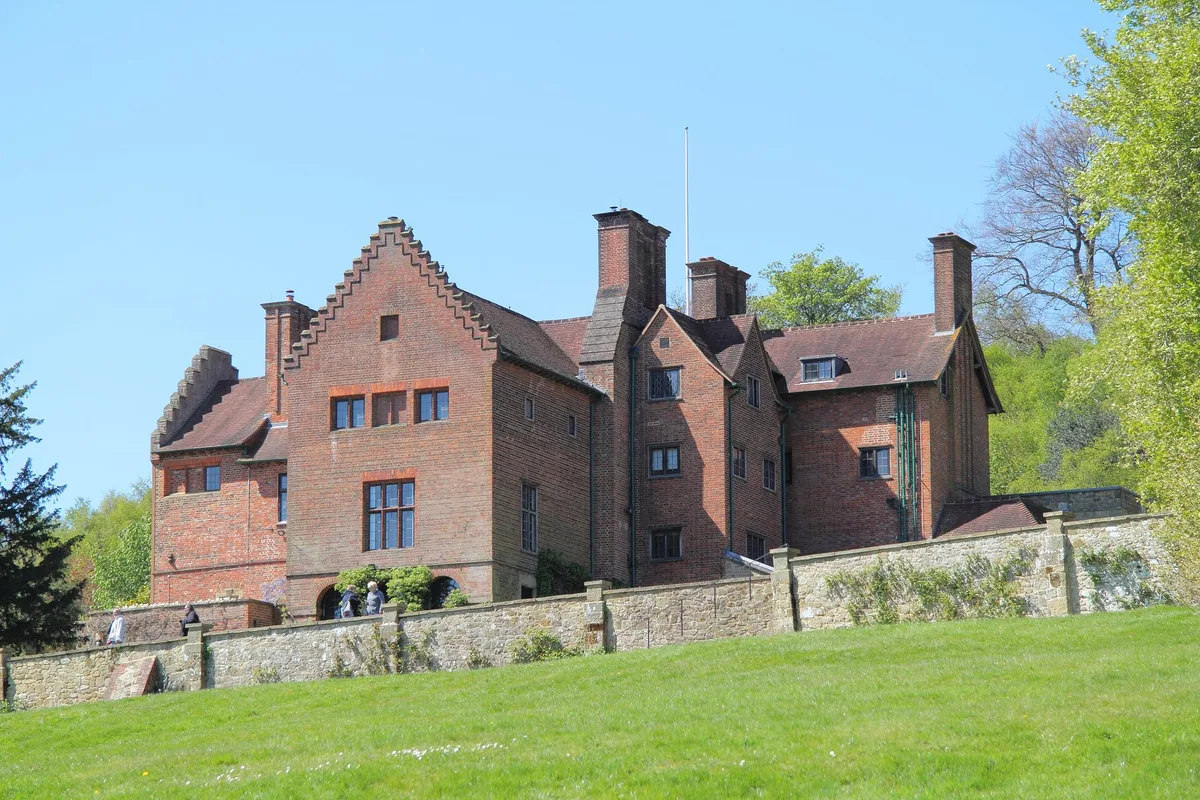 Chartwell, Winston Churchill's red-brick house near Westerham in Kent, seen from the sloping lawn below its terrace wall