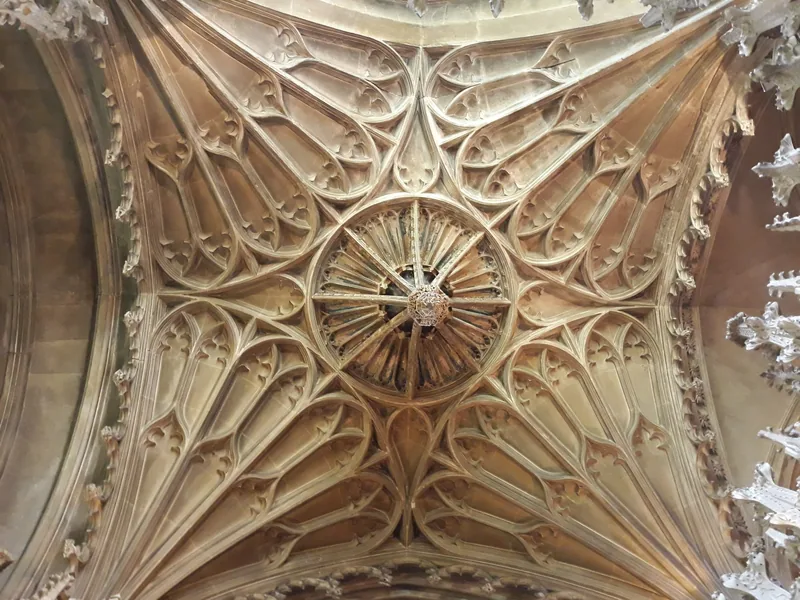 Intricate fan vaulting on a chapel ceiling inside Ely Cathedral
