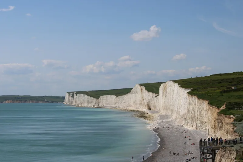 The shingle beach at the foot of the Seven Sisters, with the chalk cliffs curving into the distance