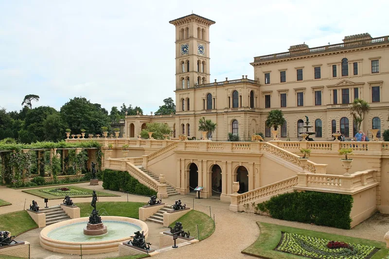 The Italianate terraces of Osborne House, Queen Victoria's island home, with its clock tower and a fountain in the parterre