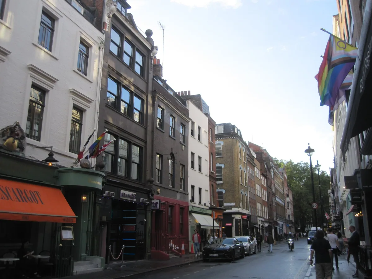 Greek Street in Soho, with the awning of a French restaurant over the pavement