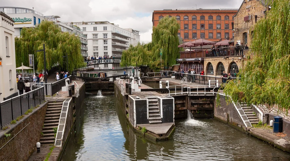 Camden Lock on the Regent's Canal with market buildings and a canalside terrace