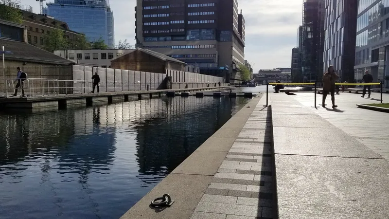 The waterside walkway at Paddington Basin looking towards the station