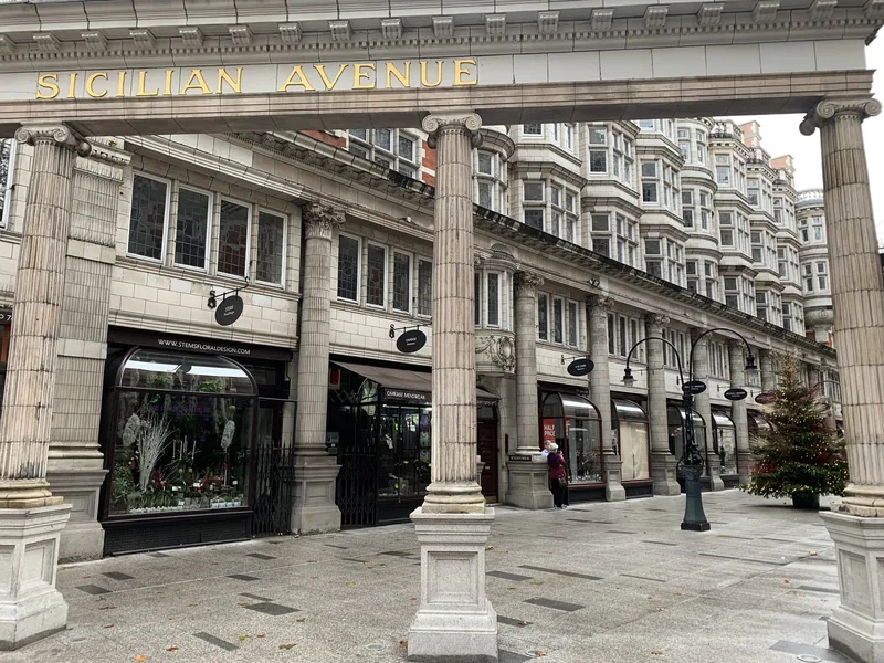 The colonnaded entrance to Sicilian Avenue in Holborn, its name in gold letters above the pillars