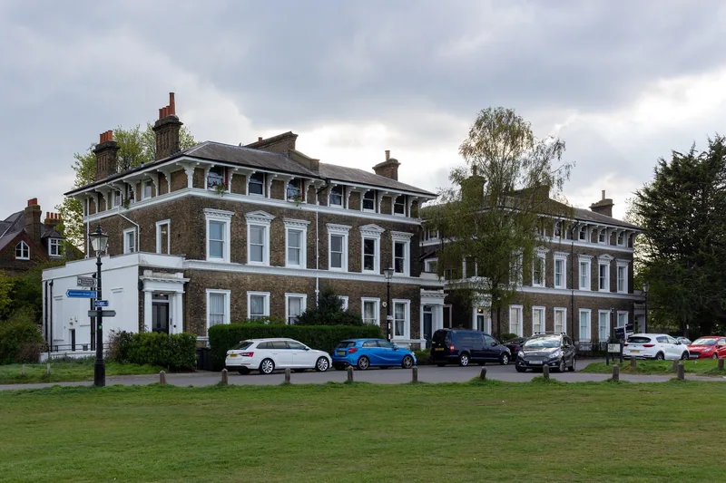 A brick Victorian terrace facing the grass at Talbot Place, Blackheath
