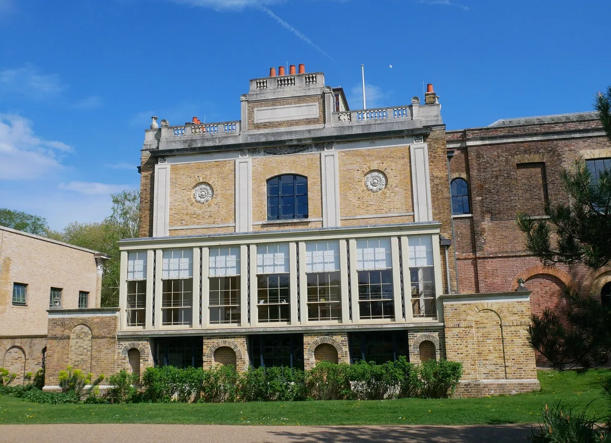 Pitzhanger Manor in Ealing seen across the lawn, its tall windows set below a parapet