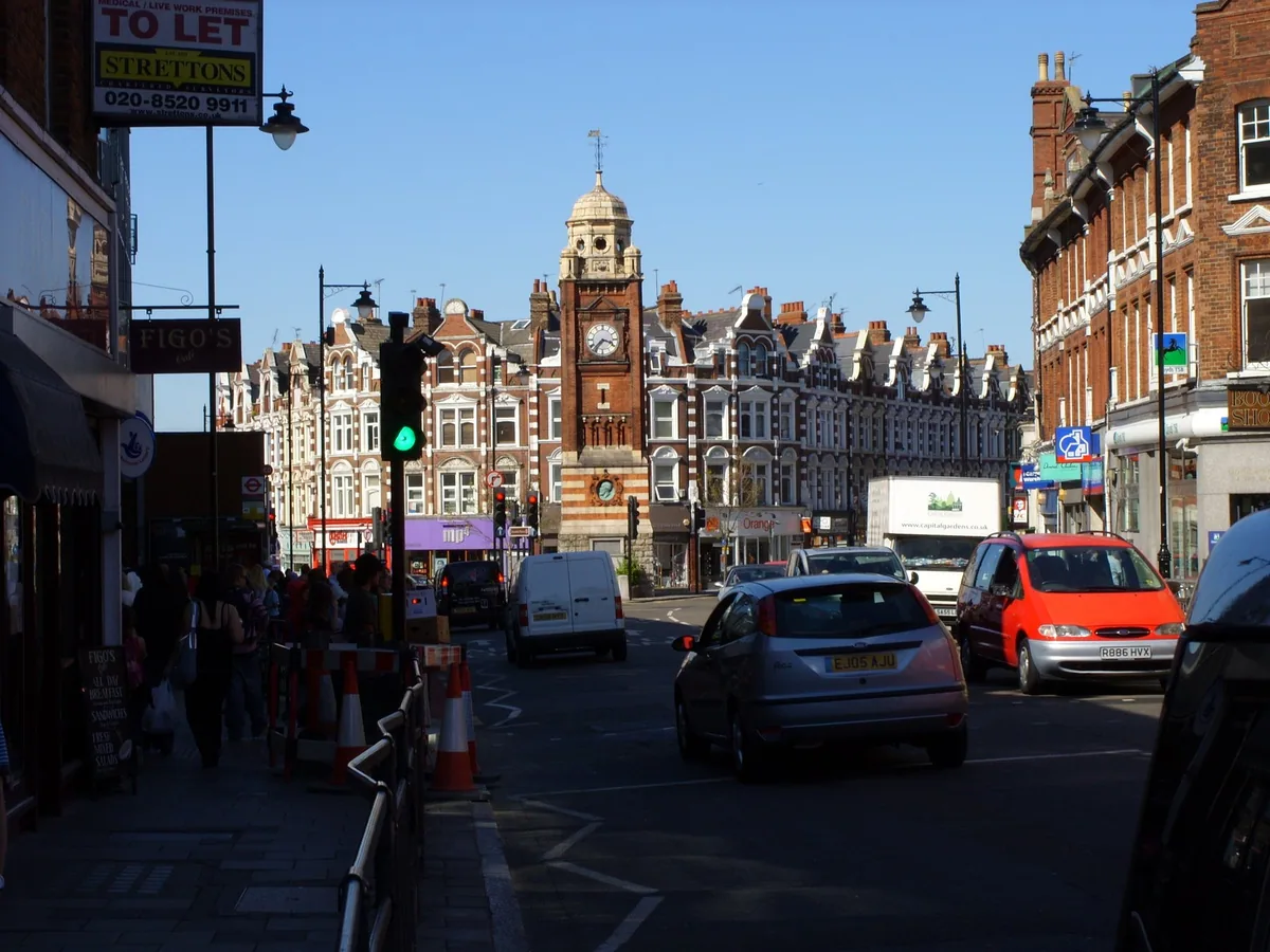 Crouch End Broadway looking towards the Victorian clock tower and the gabled red brick parade behind it