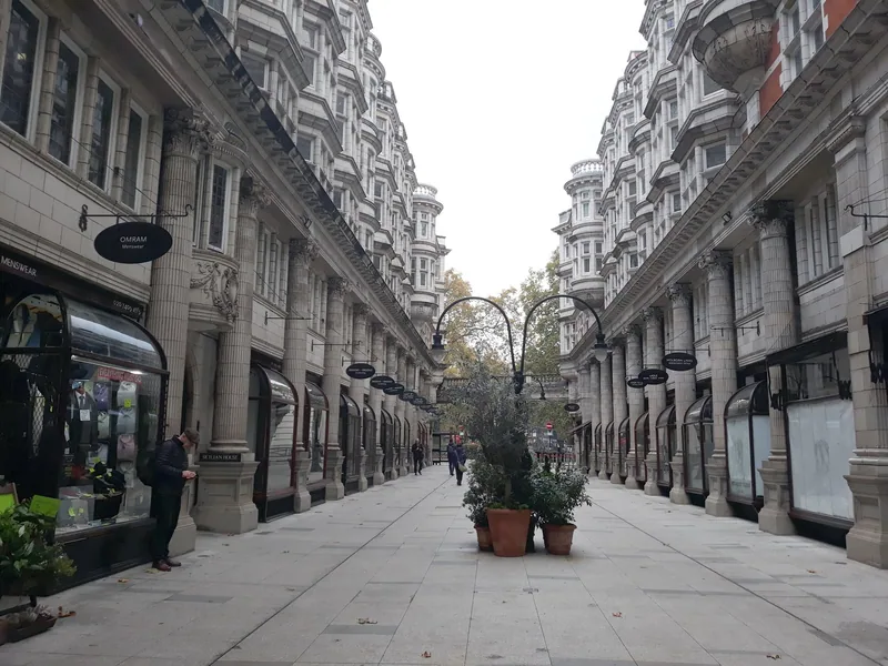 Sicilian Avenue, a colonnaded pedestrian arcade lined with shopfronts and potted trees