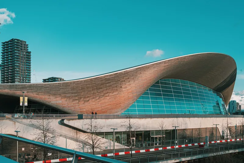 The sweeping wave-shaped roof of the London Aquatics Centre in the Olympic Park