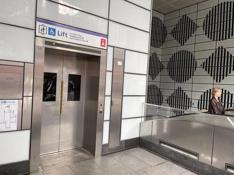 Step-free lift with a wheelchair symbol sign at Tottenham Court Road station