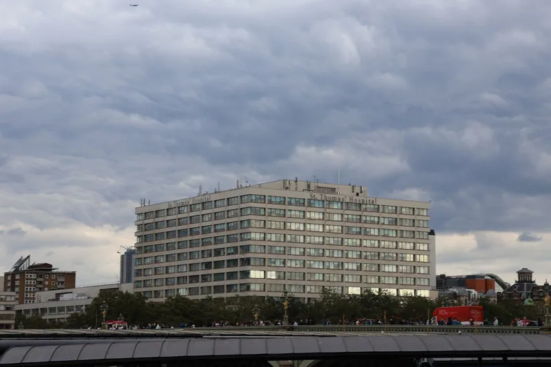 St Thomas' Hospital building on the south bank of the Thames under a cloudy sky