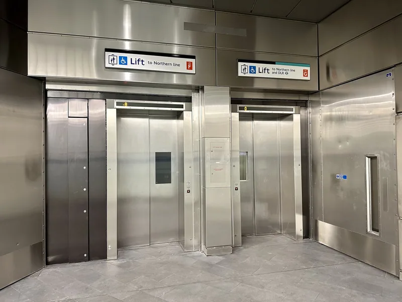Two Underground station lifts signed with the wheelchair symbol, for the Northern line and the DLR