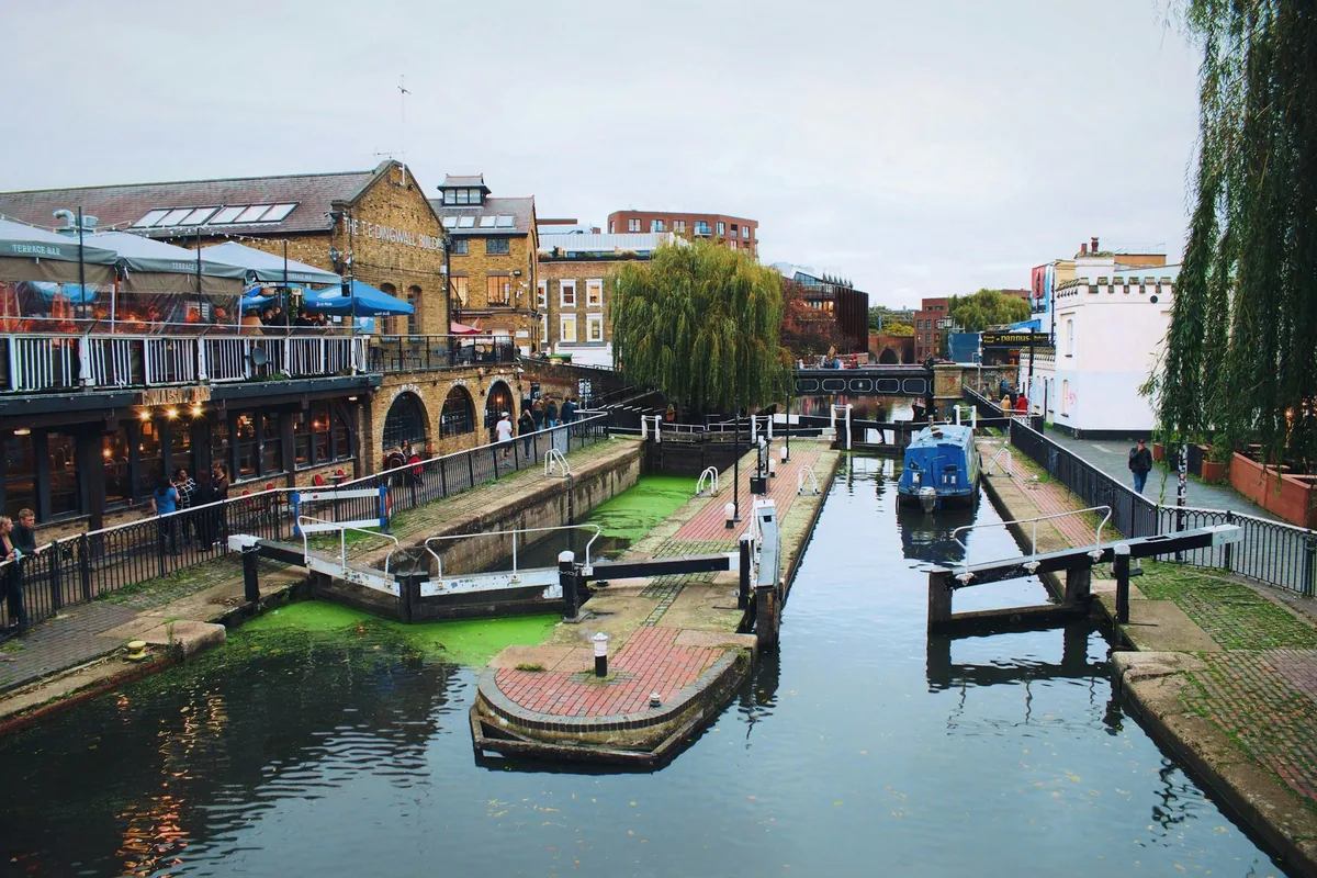 Camden Lock on Regent's Canal, with narrowboats and the market buildings along the water