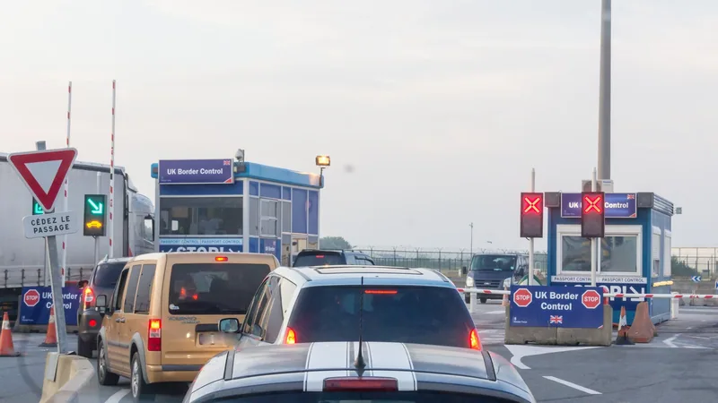 Cars queuing at the UK Border Control booths in the ferry port of Dunkirk, France