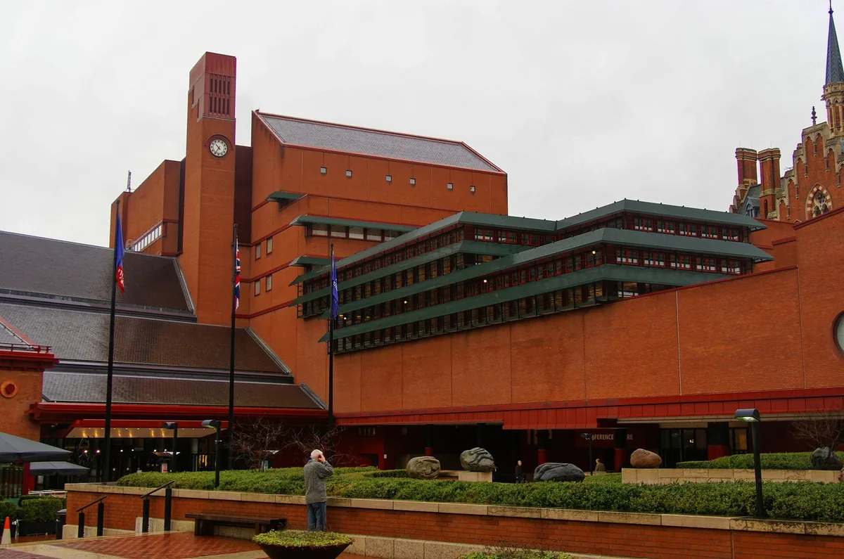 The red-brick British Library at St Pancras seen across its forecourt on an overcast day
