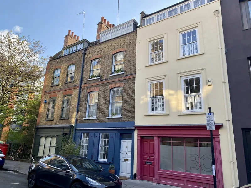 Georgian townhouses and a pink-painted shopfront on Britton Street in Clerkenwell