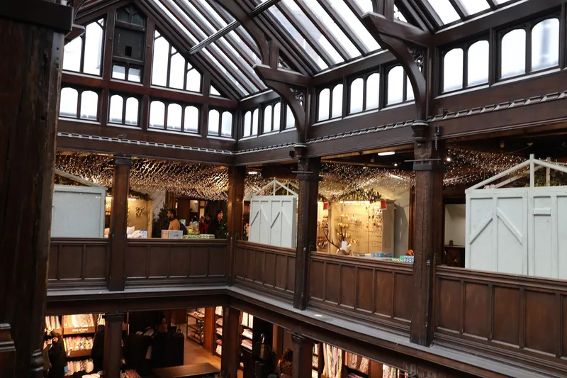 Inside Liberty, the galleried wooden atrium rising to a pitched glass roof