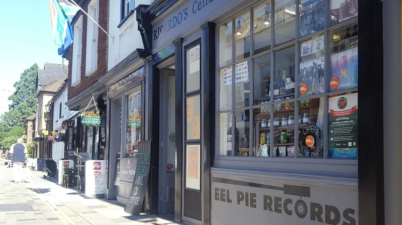 The window of Eel Pie Records on Church Street in Twickenham, filled with record sleeves and gig posters