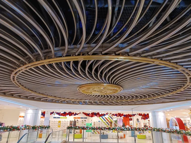 The ribbed circular ceiling above the escalator hall inside Selfridges on Oxford Street