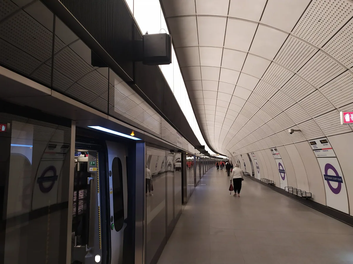 A train waiting at the step-free Elizabeth line platform at Tottenham Court Road, with platform edge doors open