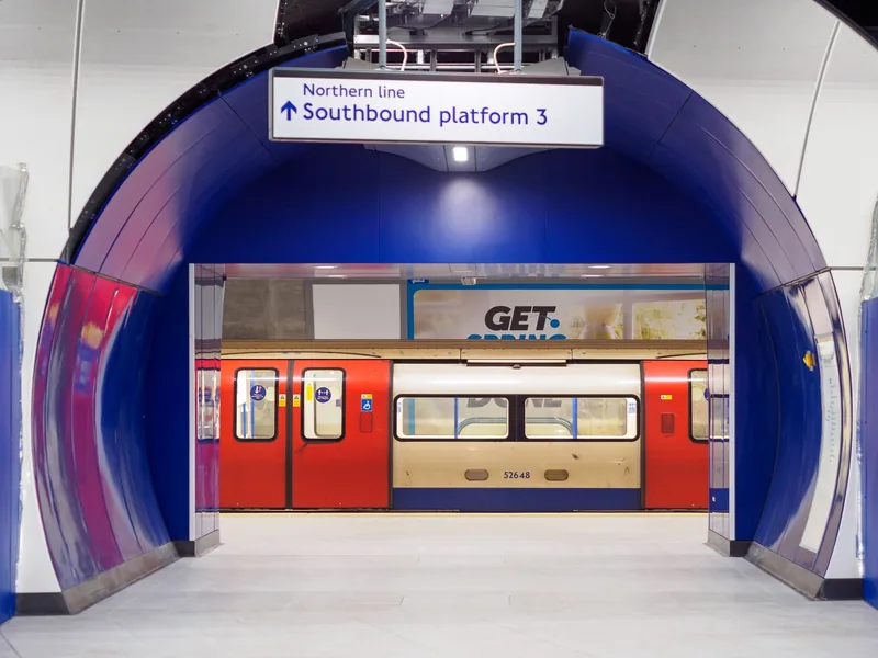 A blue tunnel arch signed Northern line southbound platform 3, with a tube train beyond