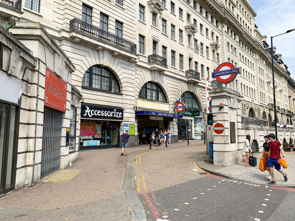 The street entrance to Baker Street tube station with its Underground roundel above the doorway