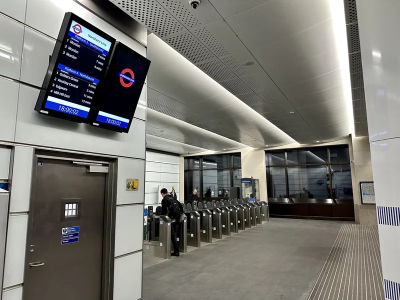 A Northern line departure board above the ticket gates at the Cannon Street entrance to Bank station