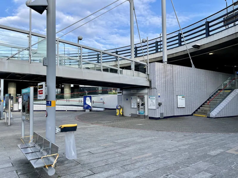 The ungated entrance area to the westbound platform at Beckton Park DLR station, with a card reader on a post