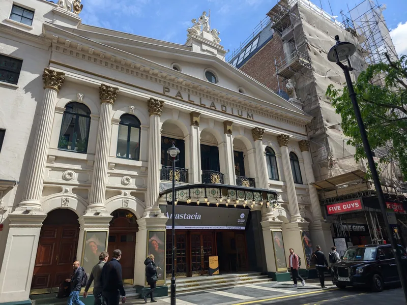 The London Palladium on its street corner, with the theatre name across the stone frontage