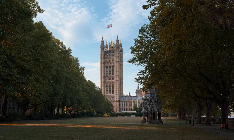Victoria Tower at the Palace of Westminster in evening light, seen from the gardens