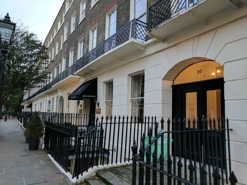 A Georgian terrace in Bloomsbury in use as a hotel, with sash windows and iron balconies